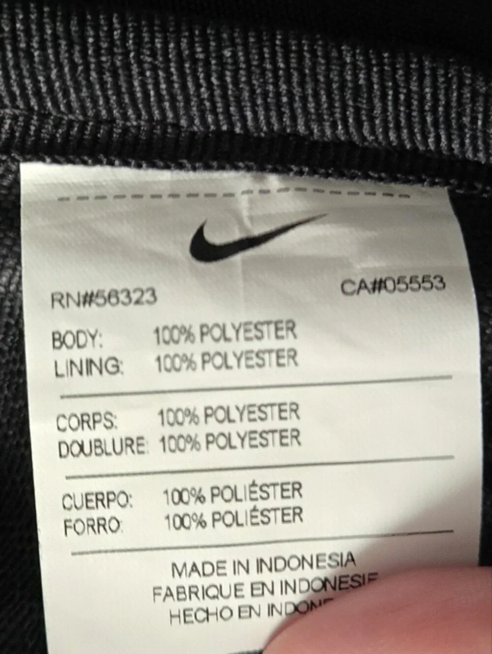 Nike Black Duffel Bag with White Swoosh and Bottom Zipper Pocket.